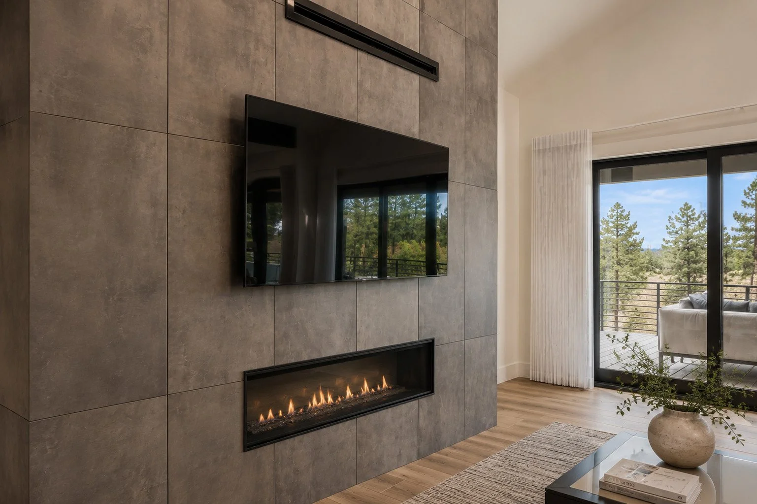 Living room with wall-mounted TV over modern fireplace, Franktown, Colorado