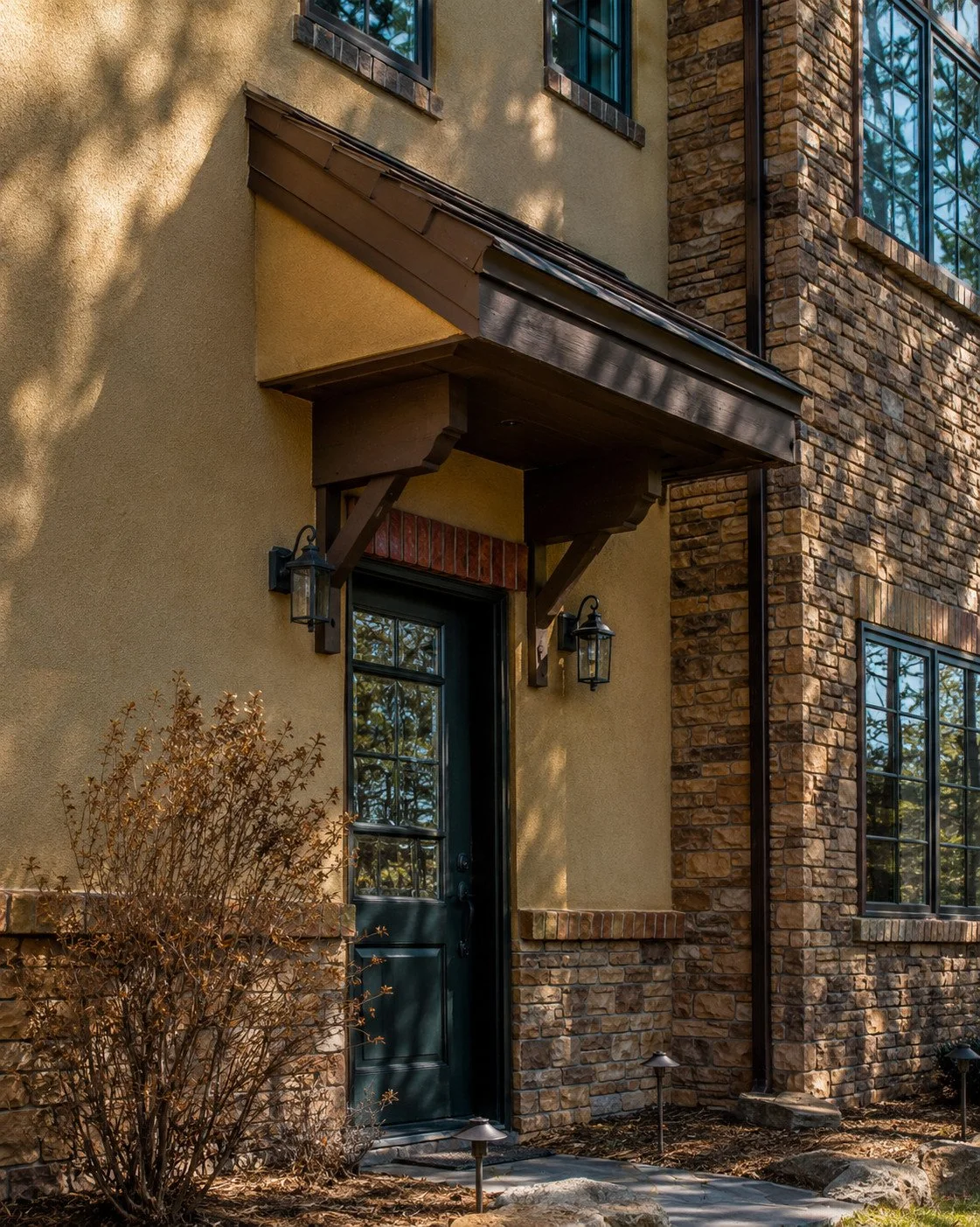 European custom home with tiled roof and timber frame awning, Castle Rock, Colorado