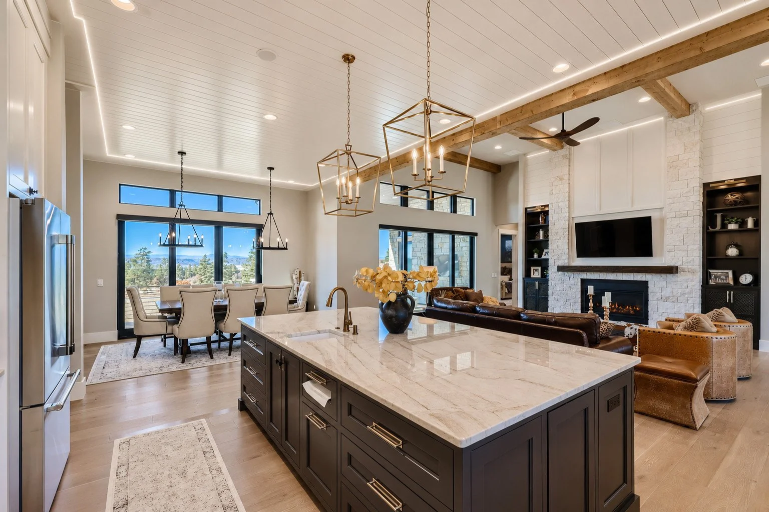 Custom kitchen with marble island overlooking outdoor living area, Franktown, Colorado