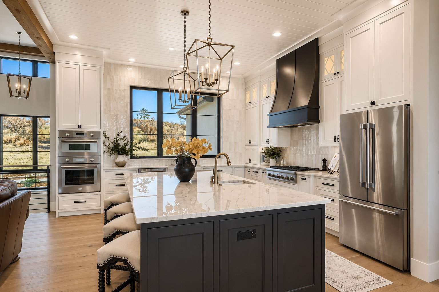 Kitchen with marble island and black-and-gold fixtures, Franktown, Colorado