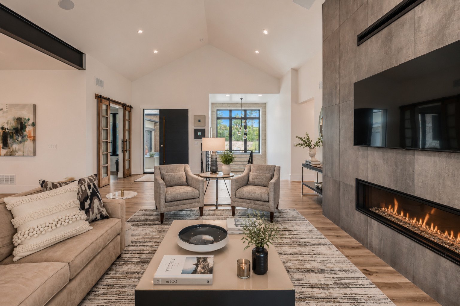 Vaulted living room with exposed steel beams and gray tile fireplace wall, Franktown, Colorado