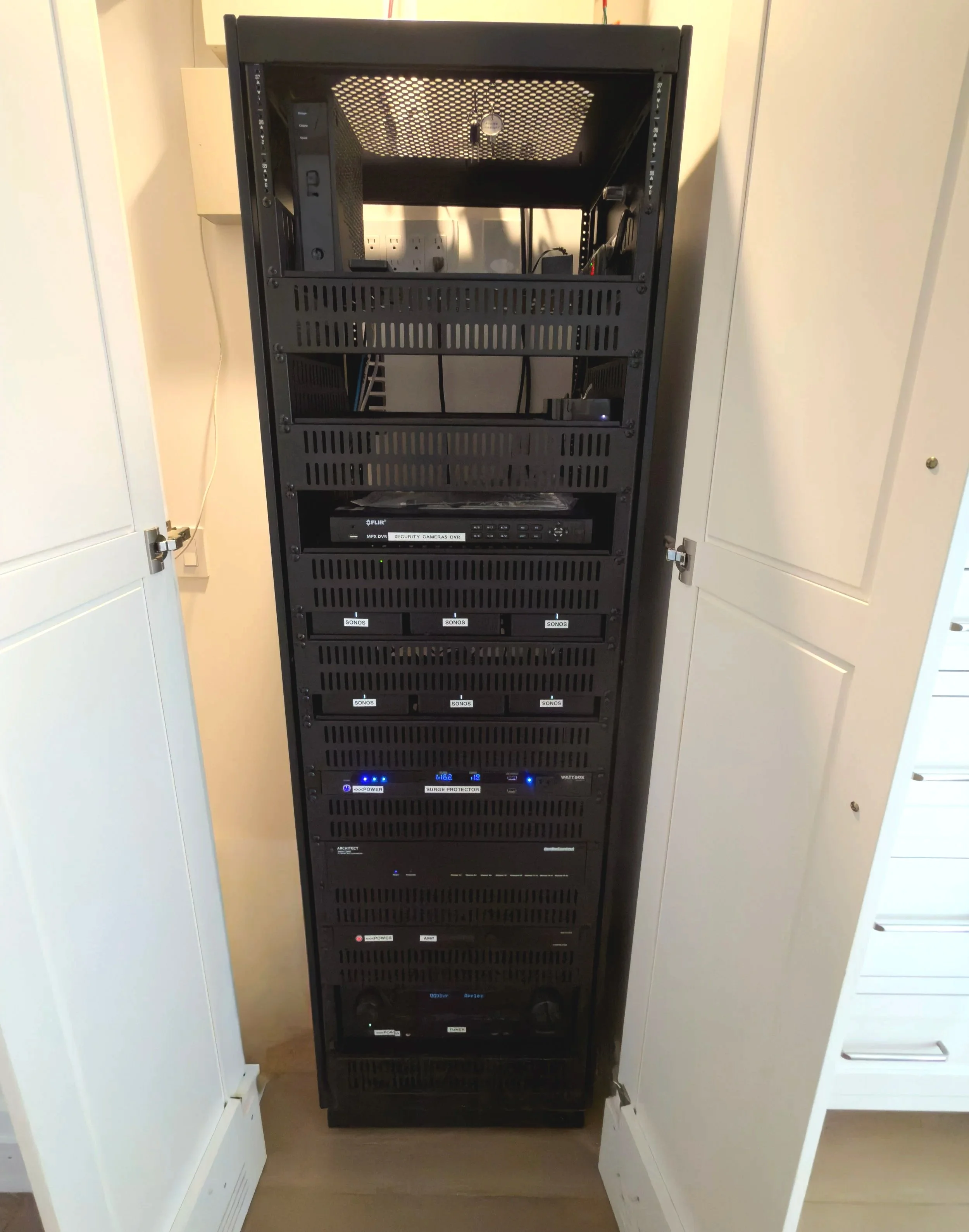A custom audio visual rack system in a closet