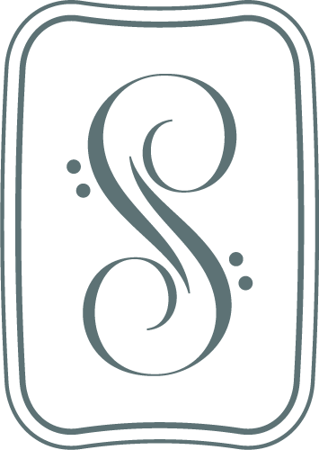 Stylized letter 'S' with decorative swirls inside a rounded rectangular border.