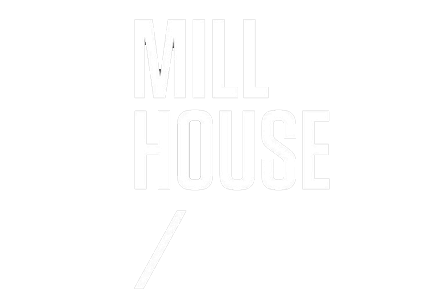 Text reading 'MILL HOUSE' with a diagonal slash below it.