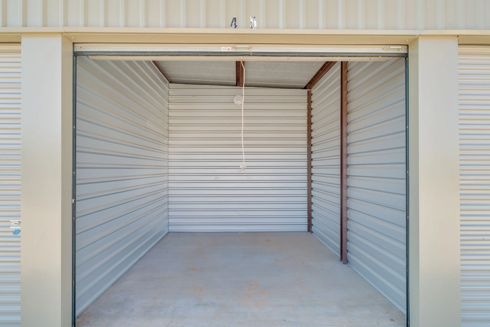 Empty 10x10 storage unit interior at Oak Cliff Self Storage OKC