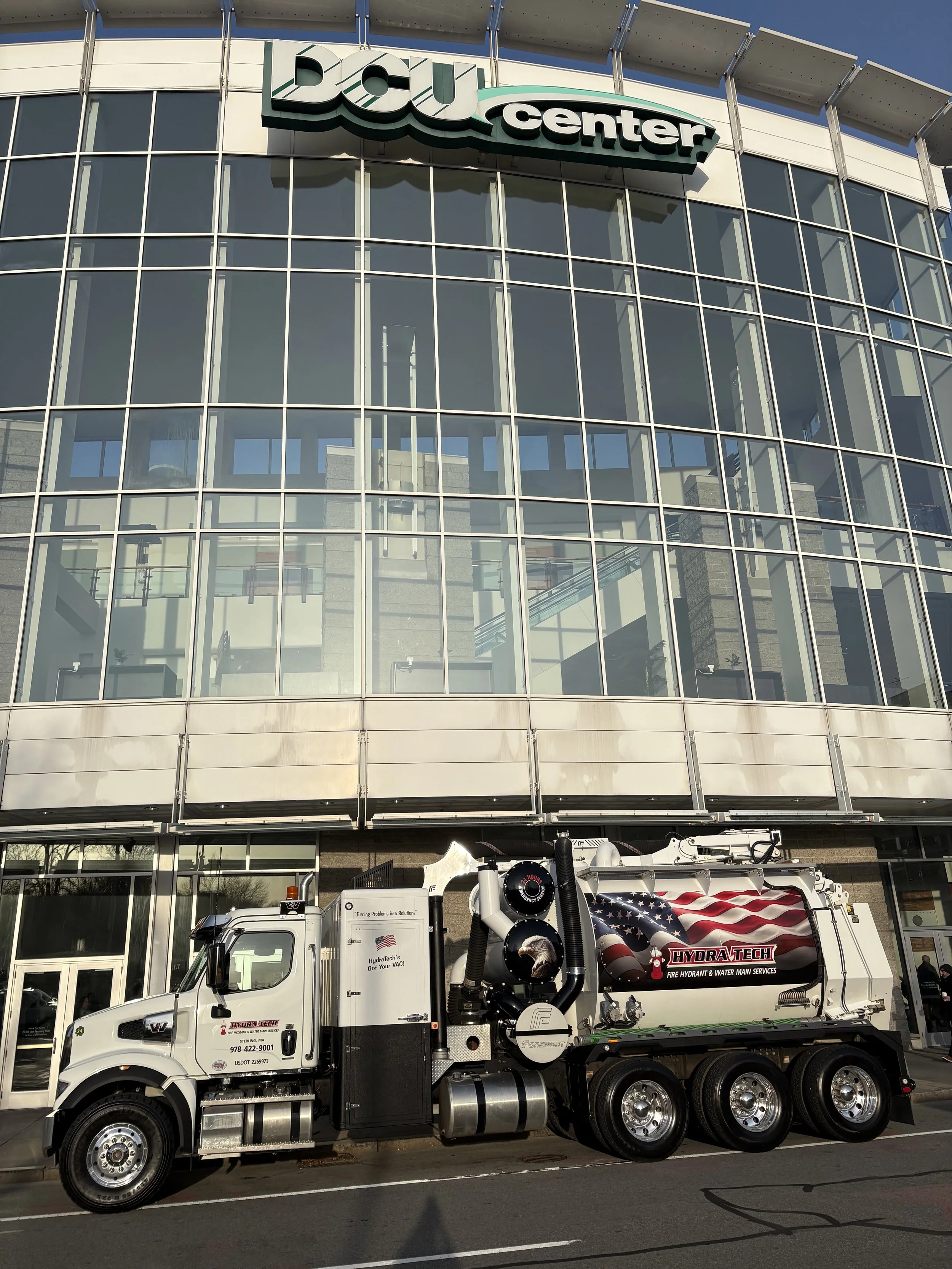 Hydrovac excavation truck in front of DCU center