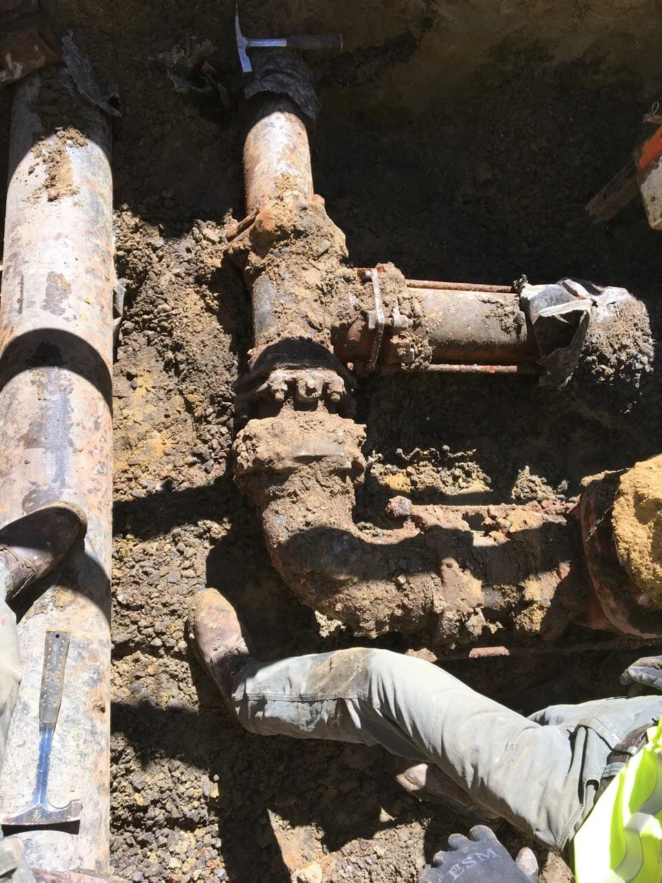 Before image of a water main repair with new valves installed.