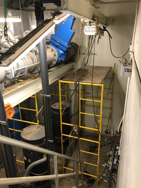 14 inch valve insertion in the ceiling inside a sewer treatment plant.