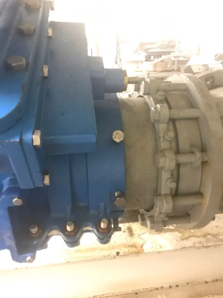 14 inch valve insertion in the ceiling inside a sewer treatment plant.