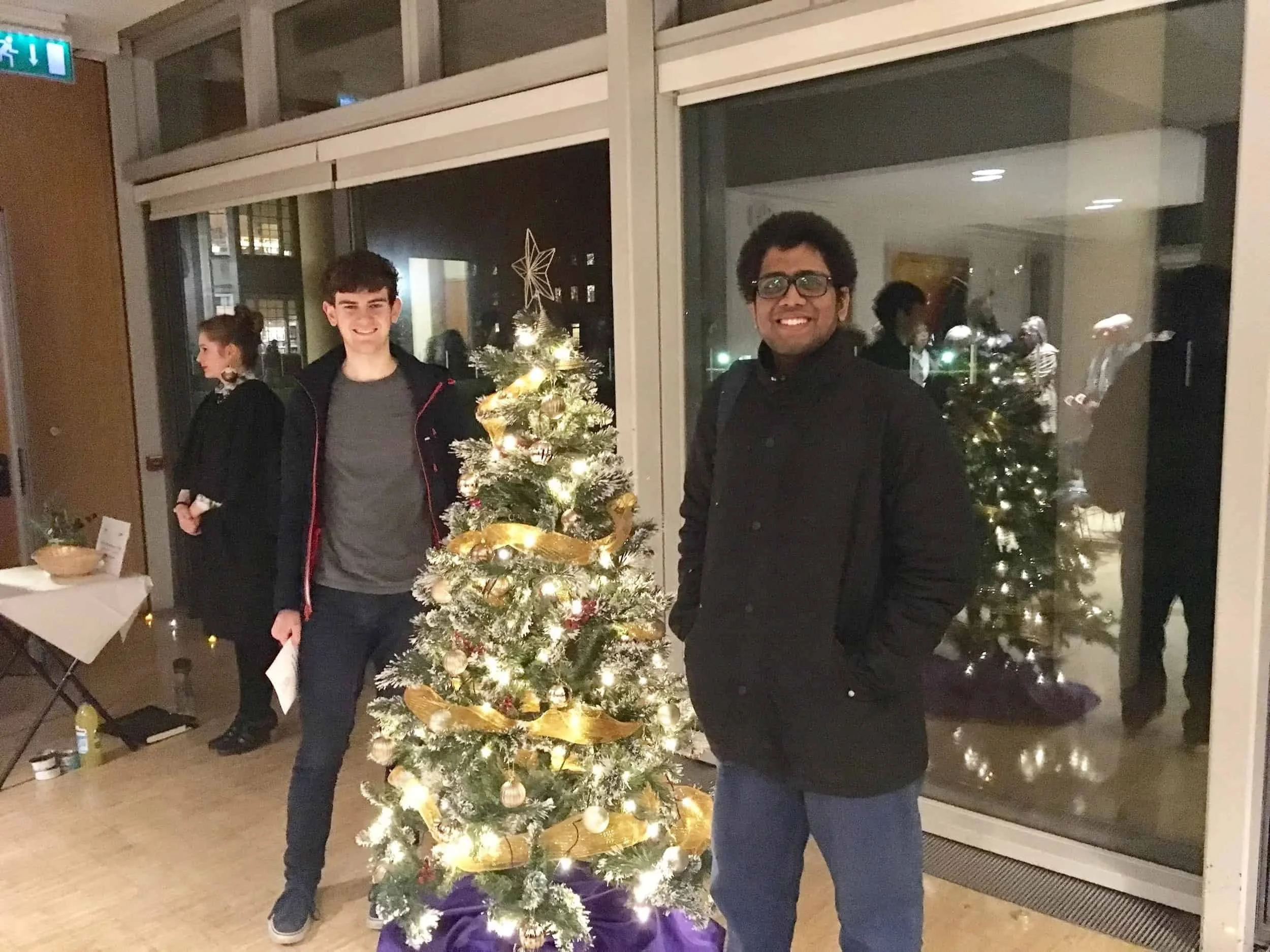 Affnafee and his friend posing with a Christmas tree in Oxford.