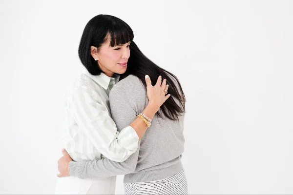 Michele embracing someone