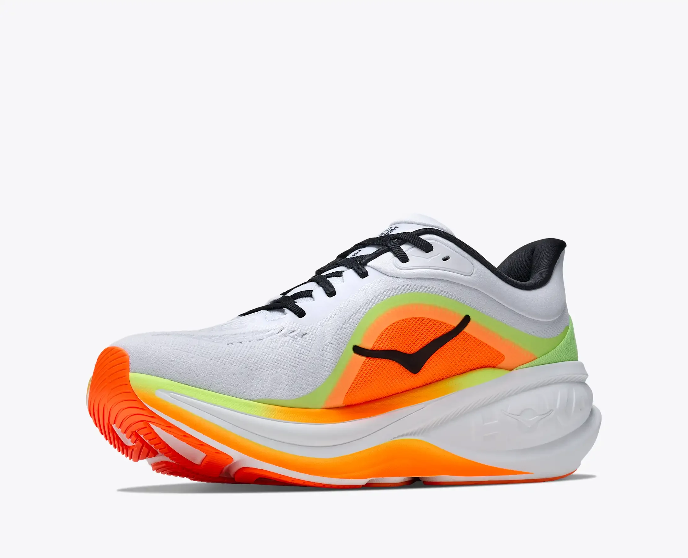 Close-up of a white athletic running shoe with black laces, orange and green accents, and an orange sole, isolated on a white background.