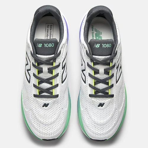 Pair of white and gray New Balance 1080 running shoes with green accents, viewed from above.