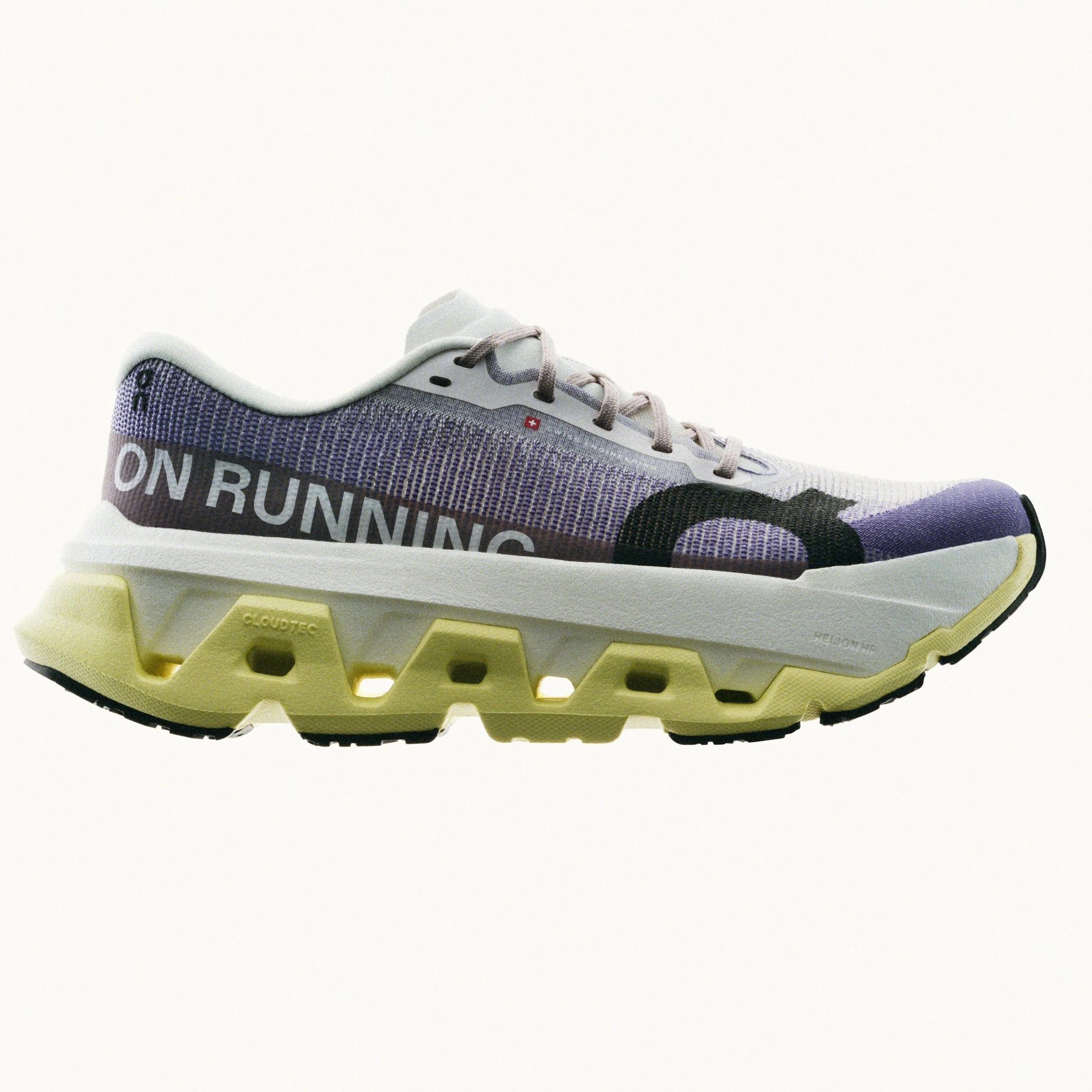 Close-up of a sneaker with a beige and purple design, black and yellow details, and the text "ON RUNNING" on the side, set against a plain white background.