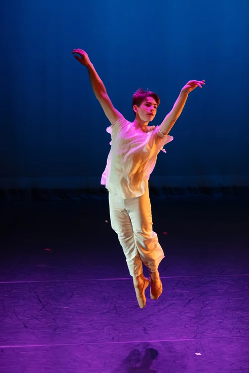 Brattleboro School of Dance student leaping onstage during a performance