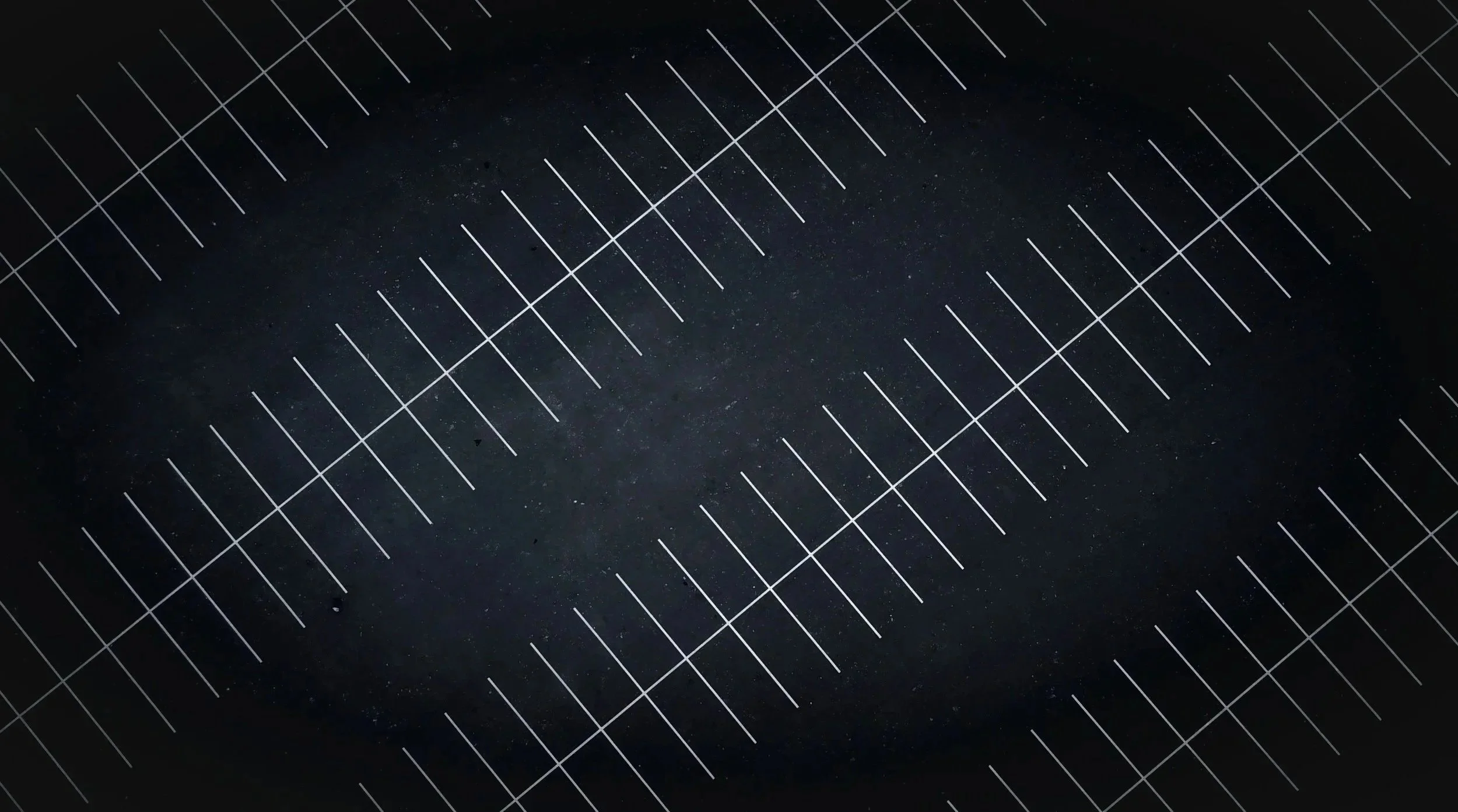 Close-up of a black surface with a grid of white lines and faint stars visible in the background.