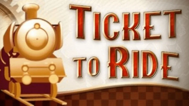Sign with a cartoon train and the words "Ticket to Ride" in large red and orange letters.