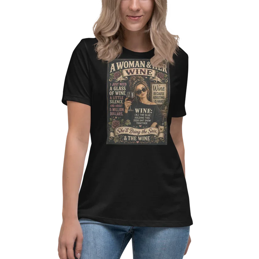 A woman wearing a black T-shirt with a graphic design and text related to wine, paired with light blue jeans.