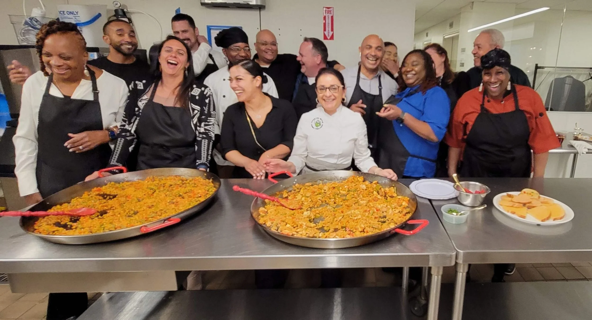 Guests participating in a Coqui the Chef® cultural cooking experience inspired by food, music, and traditions from around the world.