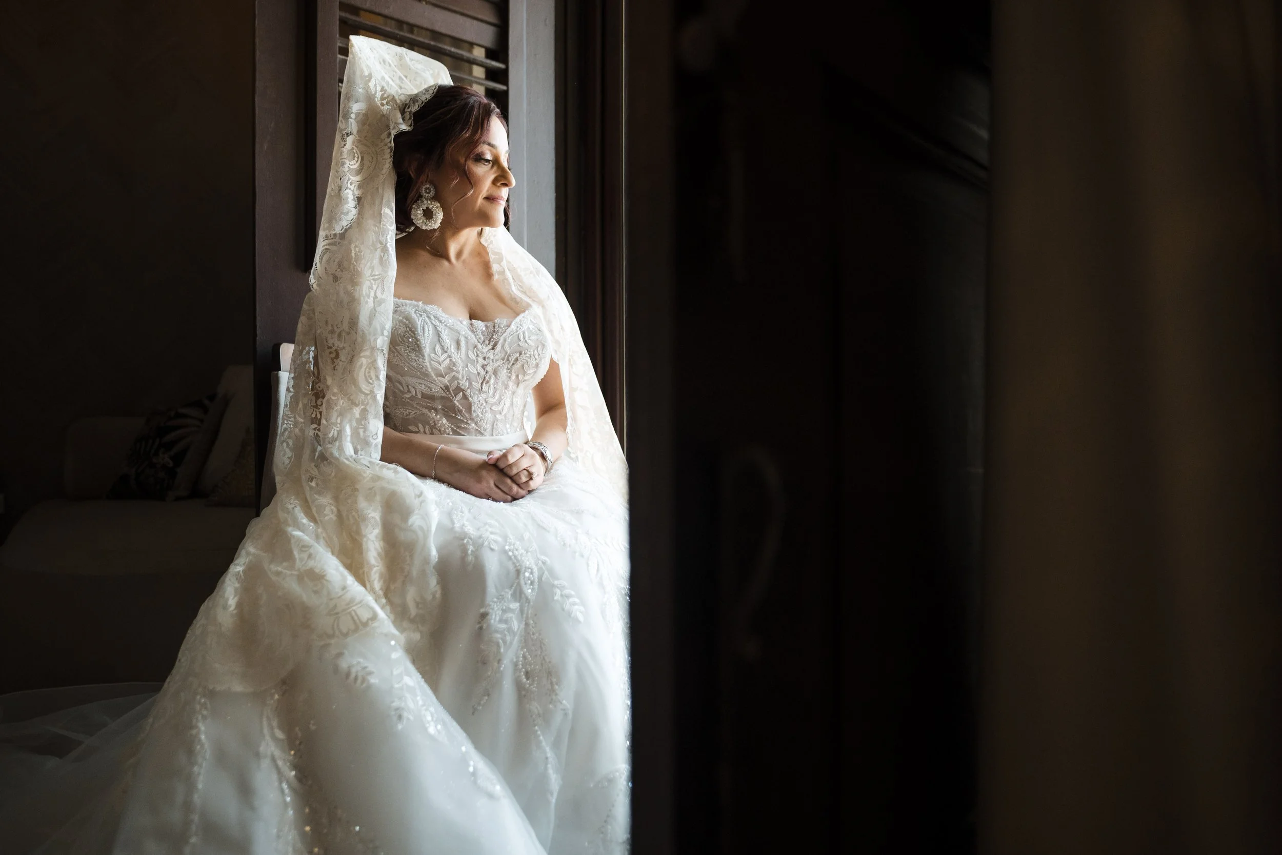 Tania Lopez wearing a Spanish peineta and lace mantilla on her wedding day in Puerto Rico.