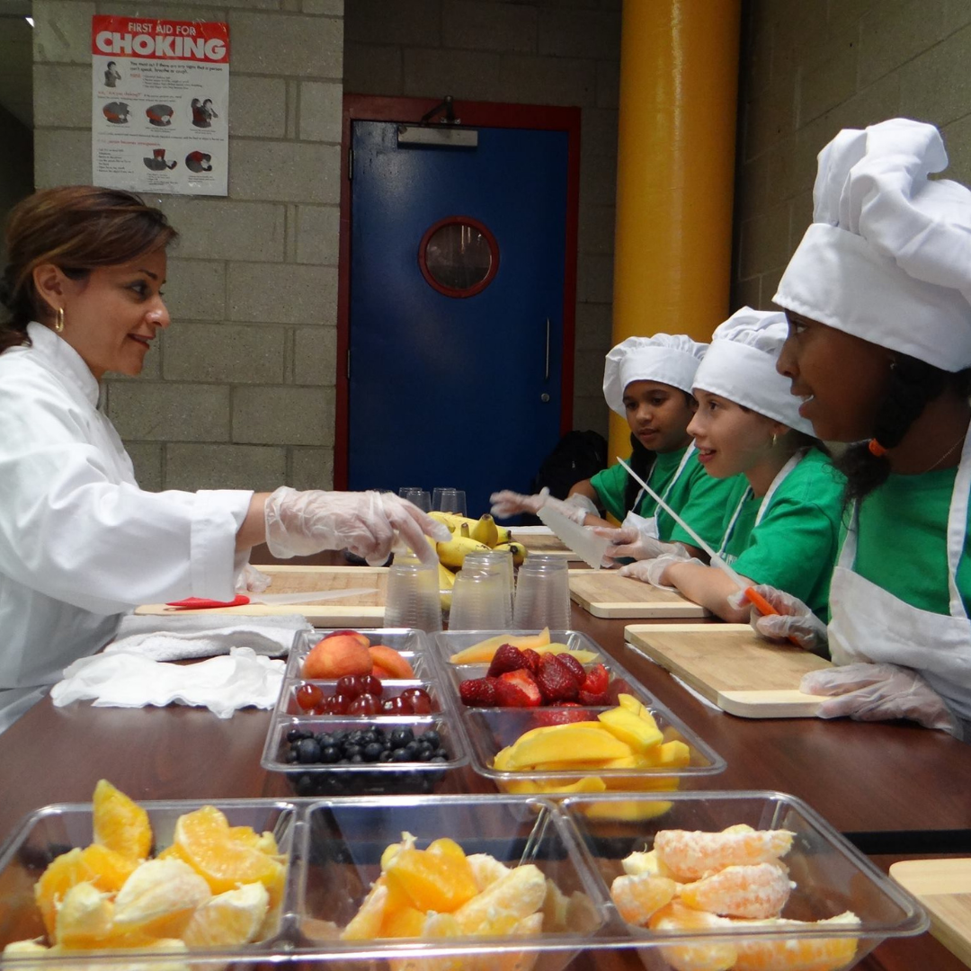 Children participating in a hands-on Coqui the Chef® cooking and food education program in New York City.