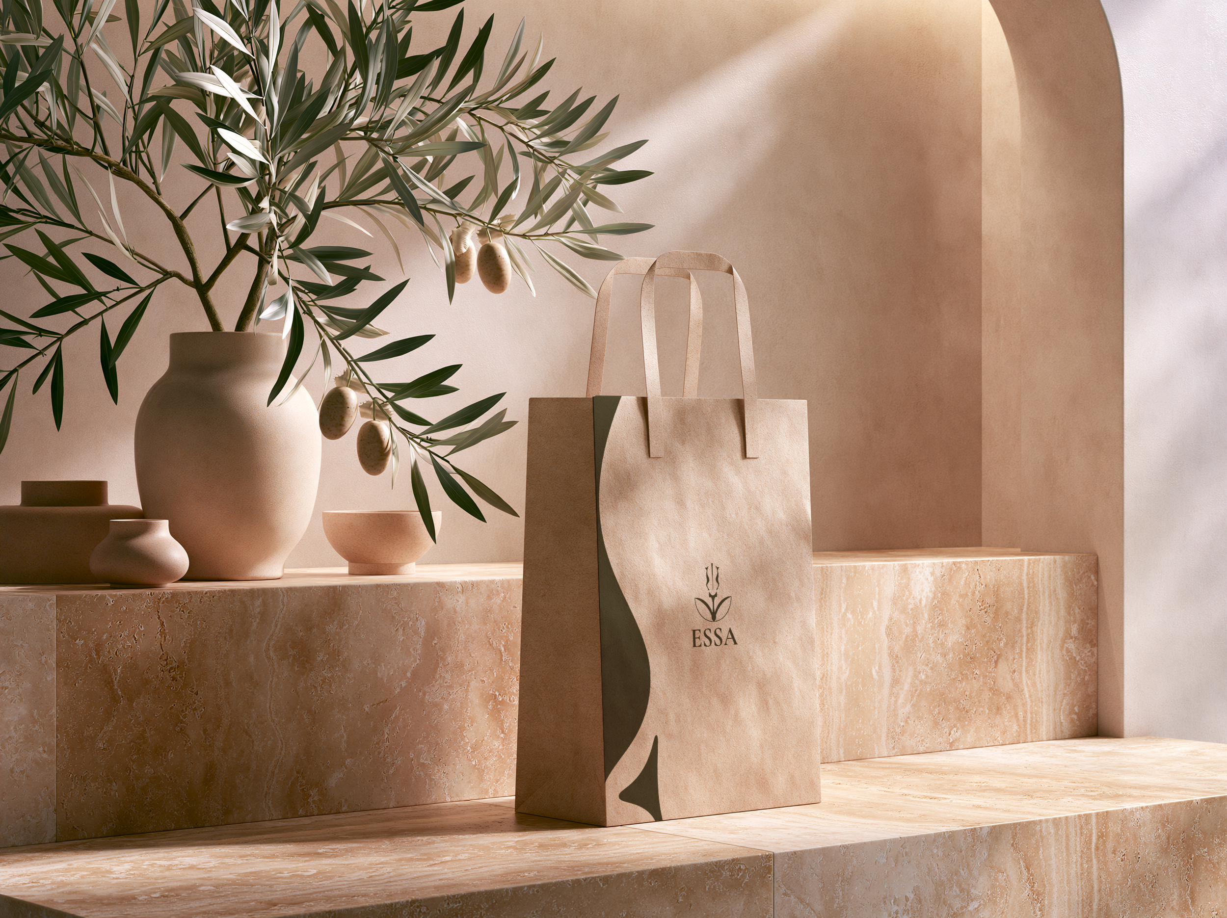 A beige and natural-toned display with potted olive branches, handmade paper bags, and a small bottle, arranged on a textured marble surface, with a soft shadow cast on a peach-colored wall.