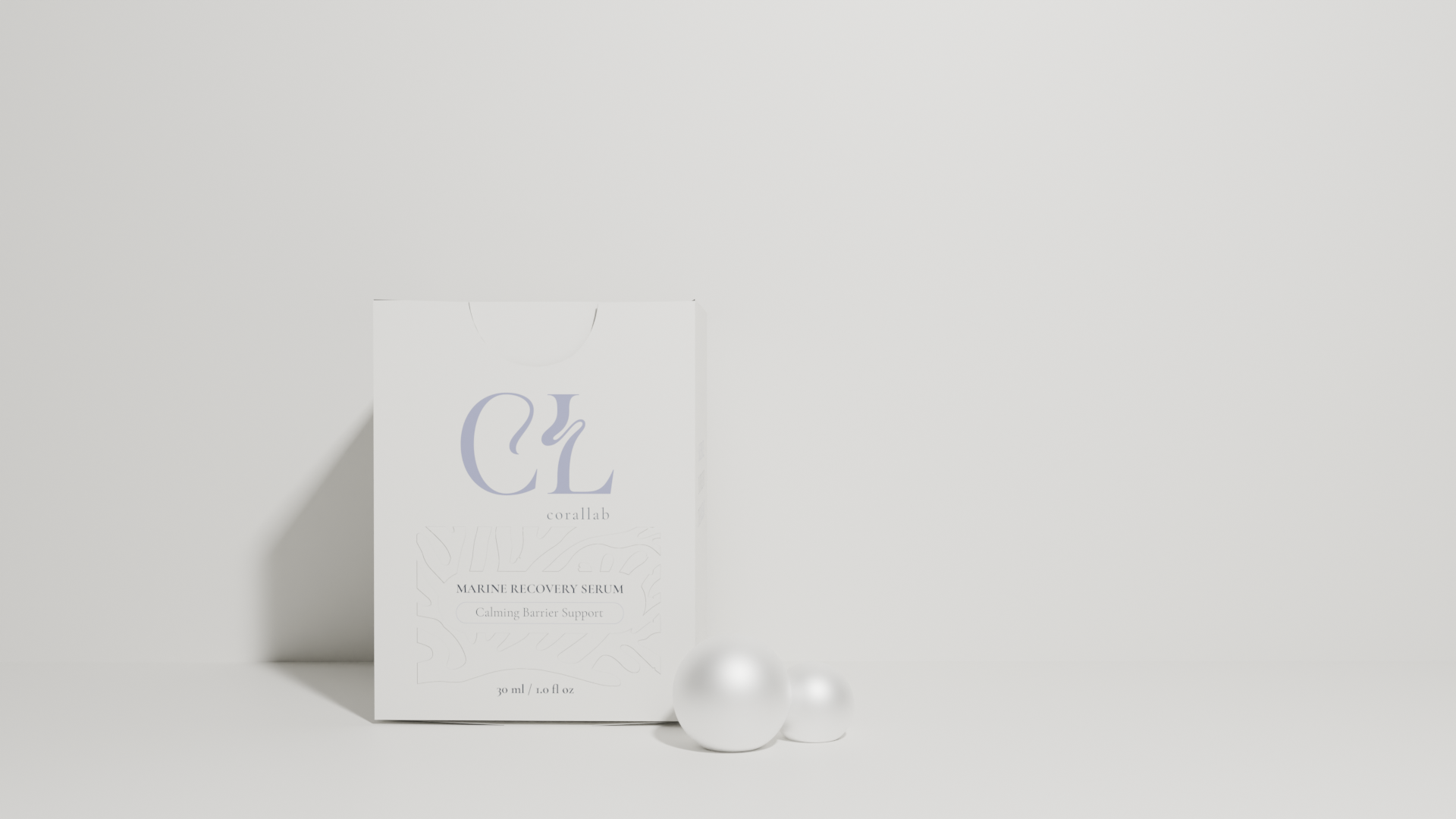 White box labeled 'Corallab Marine Recovery Serum' with minimalist design, next to two white spherical objects on a white background.