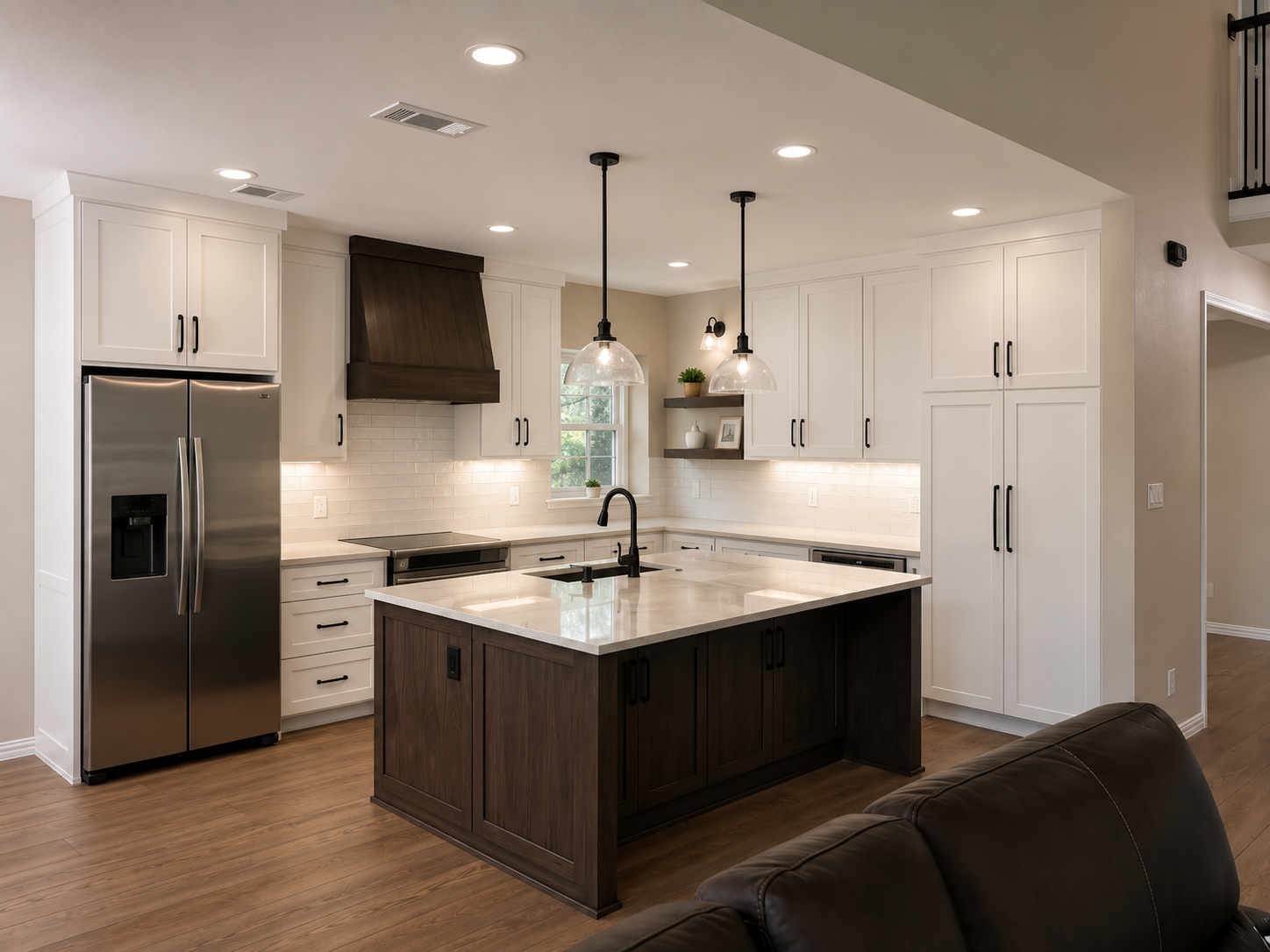 Modern kitchen with white cabinets, a dark wood island, stainless steel refrigerator, pendant lights, white subway tile backsplash, and wooden flooring.