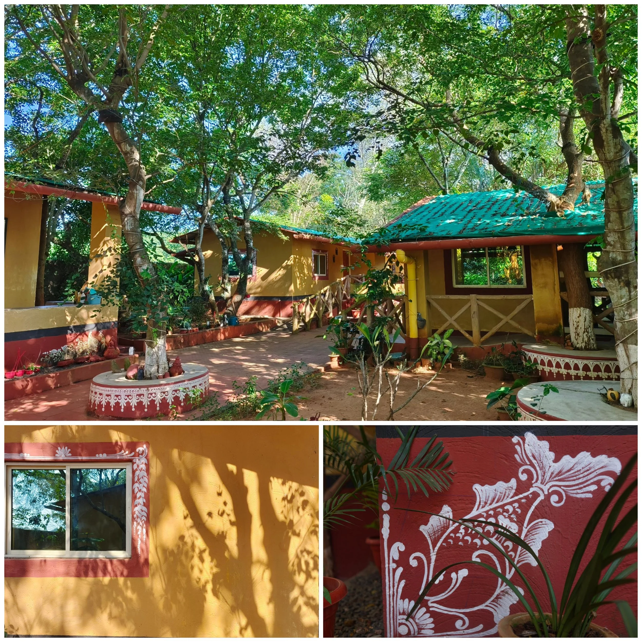 A courtyard with yellow walls, a window with white frame, trees with green leaves, and a roof with blue tiles. Shadows of leaves are cast on the walls. There is a decorative red and white painted round container and potted plants. The overall scene is bright and lush.