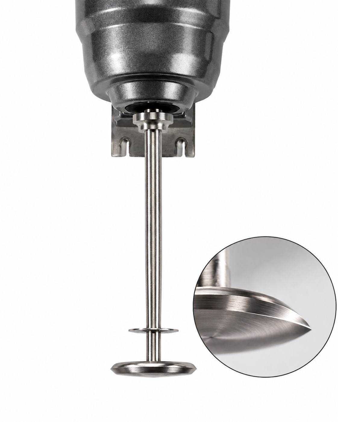 Close-up of a metal industrial mixer or agitator, showing a long shaft with a circular blade attached, and an inset highlighting the blade's edge.