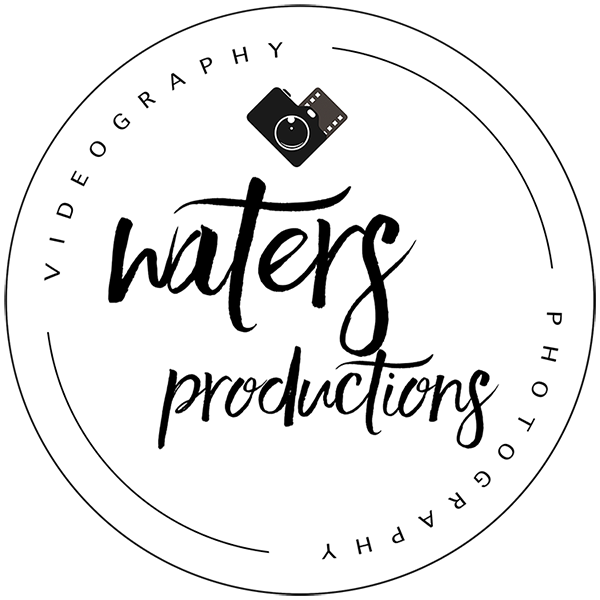 Logo for Waters Productions featuring a circular design with text 'waters productions' in the center, a small camera icon above, and the words 'videography' and 'photography' around the circle.