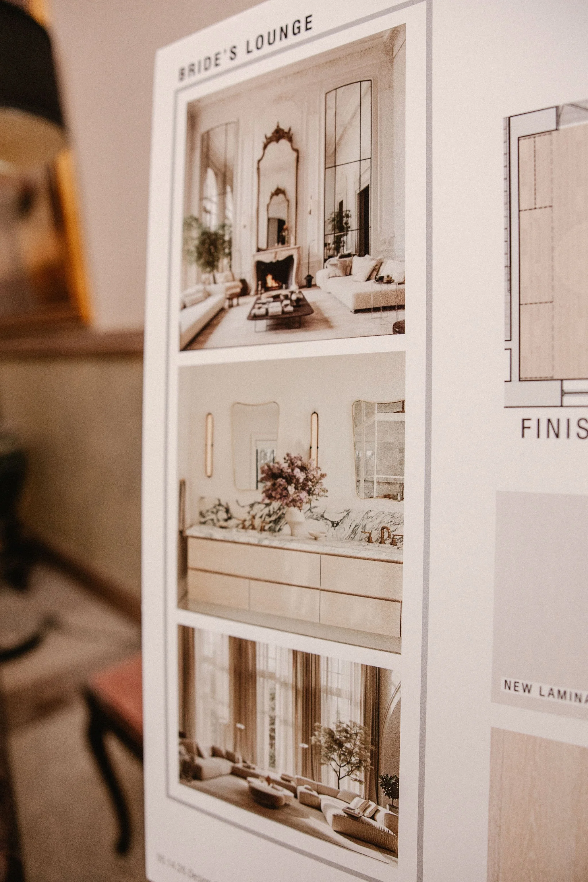 A printed interior design concept board with images of a luxurious living room with high ceilings, large windows, and elegant decor, including a fireplace and comfortable furniture.