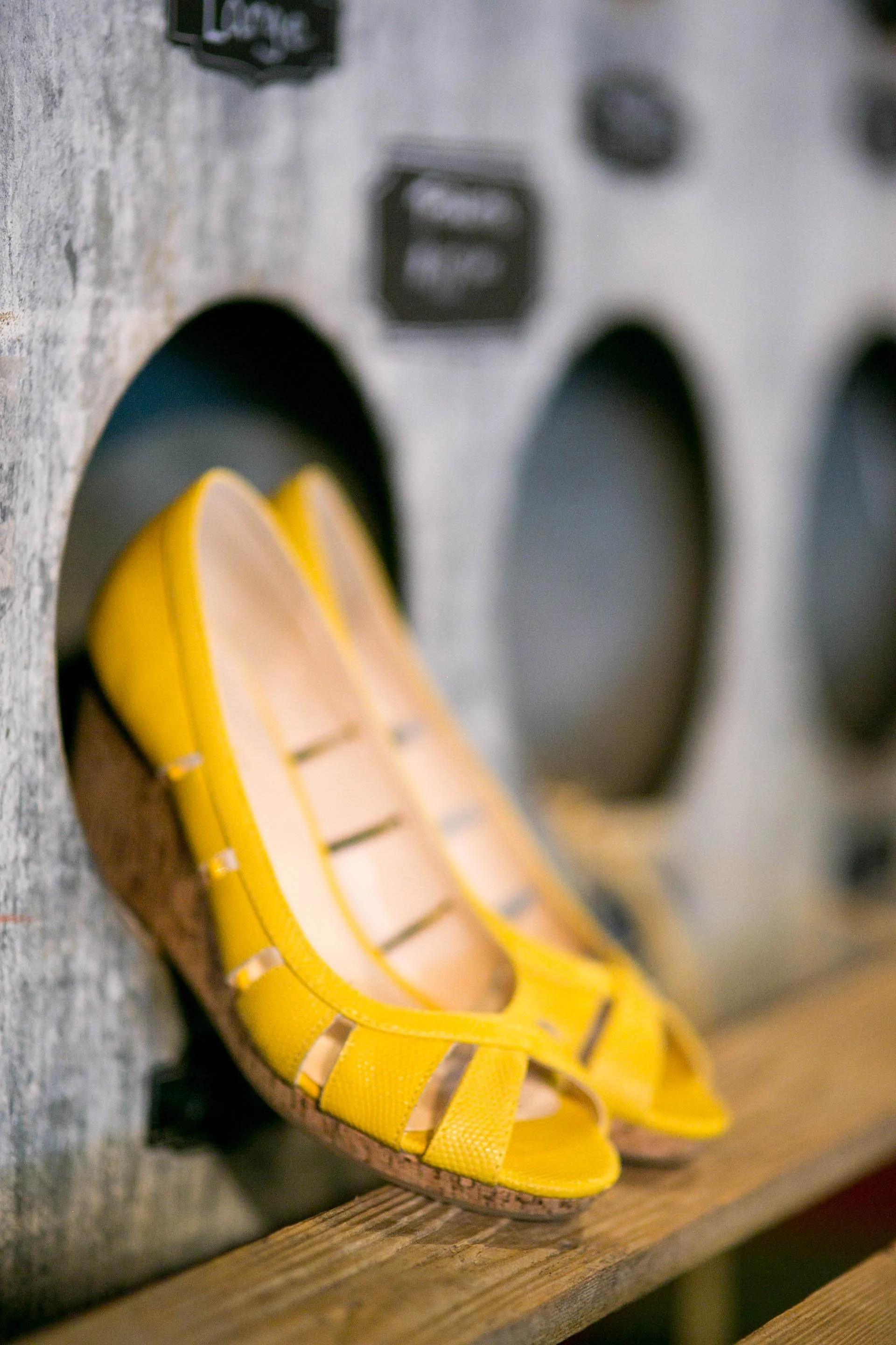 Yellow and tan slide on a wooden surface.