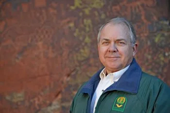 Ken Zoll standing in front of one of the petroglyph panels at the Crane Petroglyph Heritage Site in the Coconino National Forest, southeast of Sedona, Arizona.