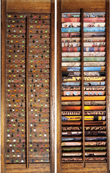 A vintage wooden shutter, front and back, one side with small figures and the other with a collage of historical events.