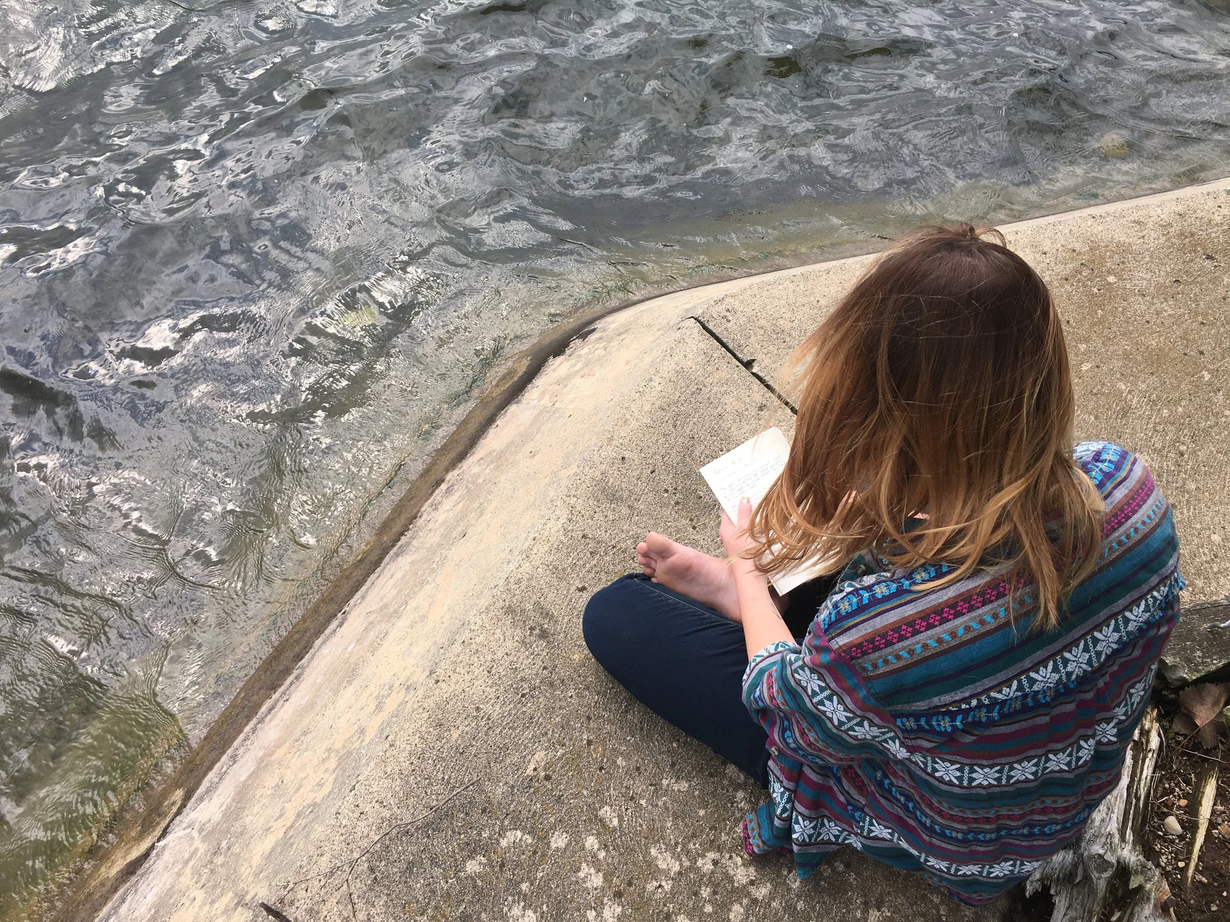 Olyvia Fulford enjoys her quiet time with God by the edge of the lake that cool morning