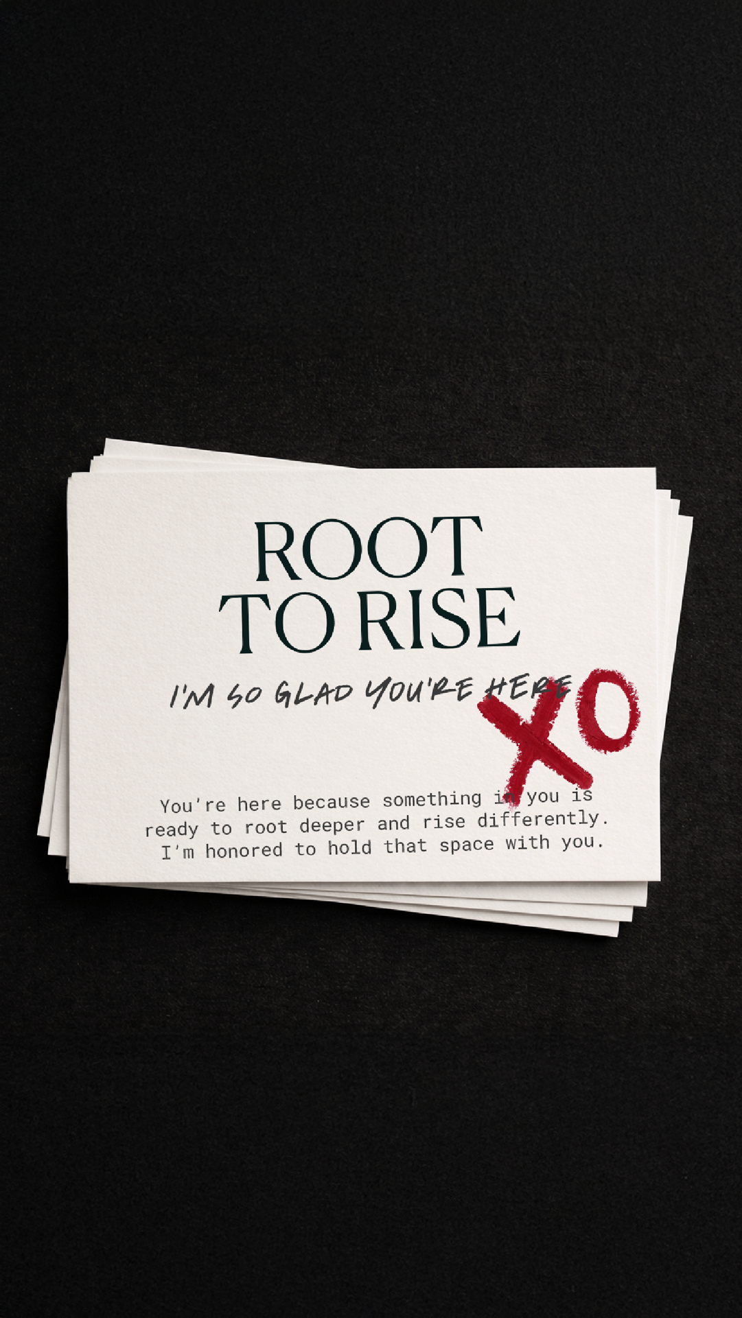 Stack of white branded welcome cards with black text on a black background. The text reads, "ROOT TO RISE, I'M SO GLAD YOU'RE HERE" with a red "XO" beneath.