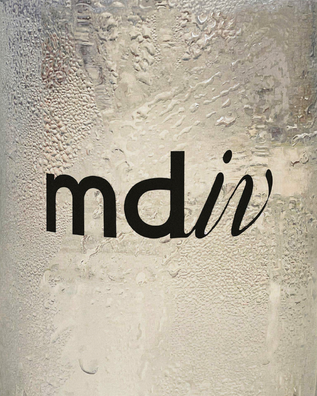 The md iv wellness logo in black on a foggy, condensation-covered glass surface.