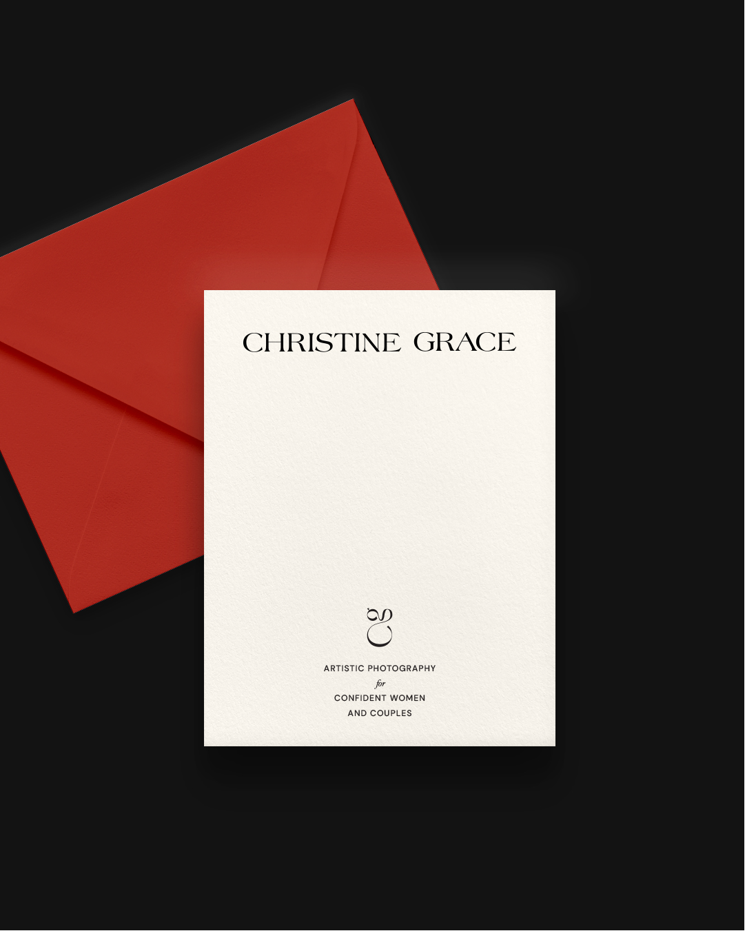 Elegant branded card with the name 'Christine Grace' and text 'artistic photography for confident women and couples,' in front of a red envelope on a black background.