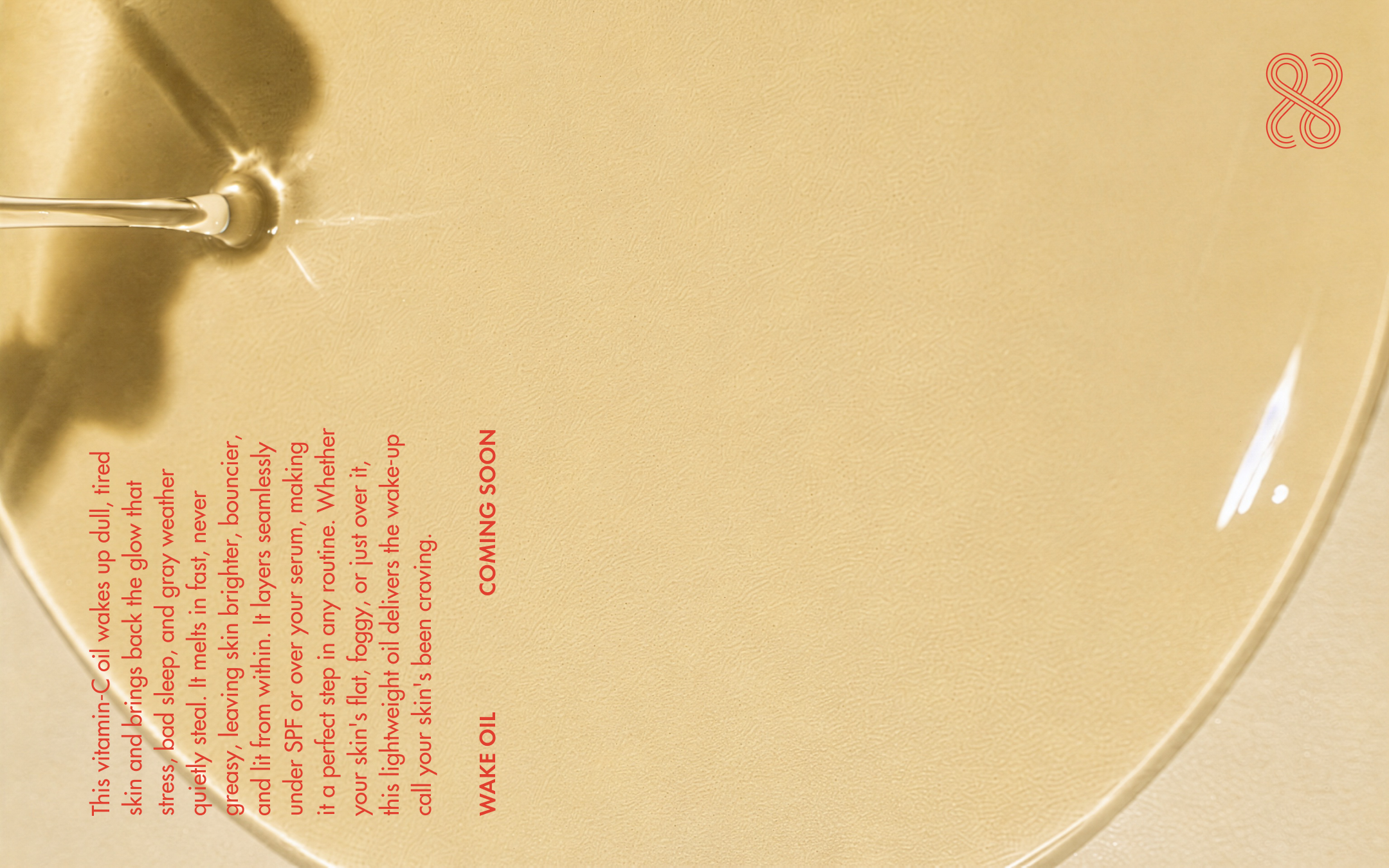 Close-up of a gold-colored surface with a skincare serum poured on top with printed red text on it.