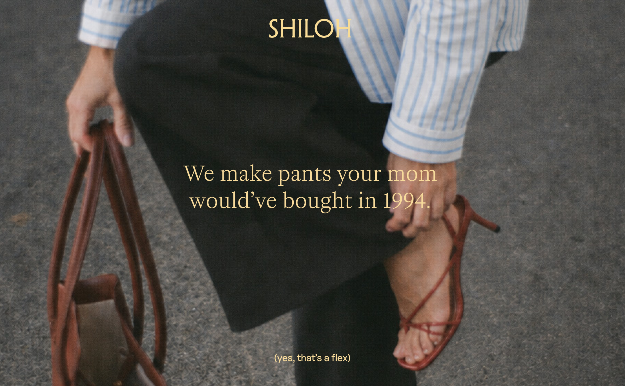 A person wearing a light blue and white striped shirt, dark pants, and red high-heeled sandals, holding a brown handbag. Text on the image reads: "SHILOH" and "We make pants your mom would've bought in 1994."