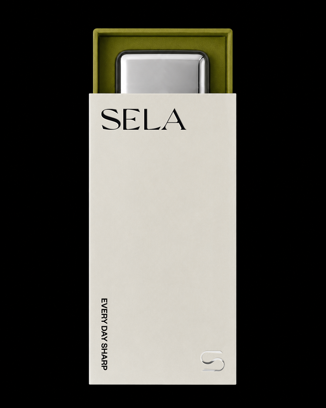 A sleek metal jewelry case inside a green box, with the SELA logo imprinted on it along with the tagline 'Every Day Sharp' in silver foil, set against a black background.