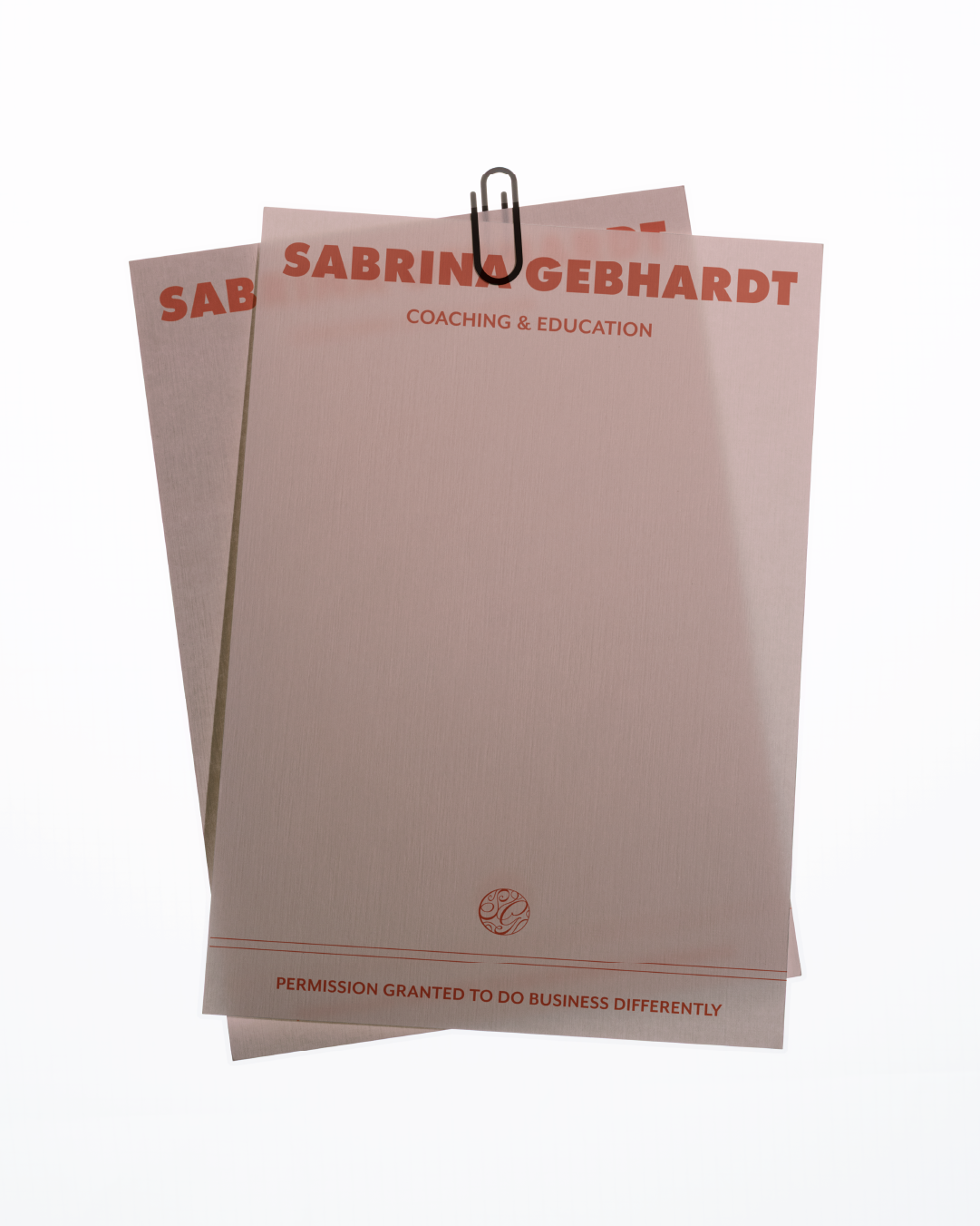 Branded notepad for Sabrina Gebhardt, coaching and education, attached to a paper clip.
