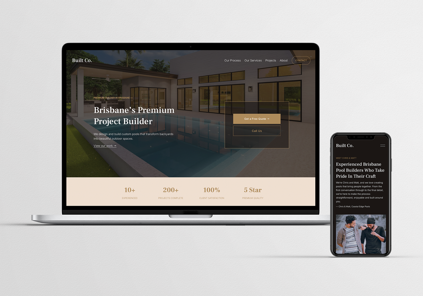 A computer and smartphone displaying a construction company's website with images of a modern house and pool, and text about pool building services.