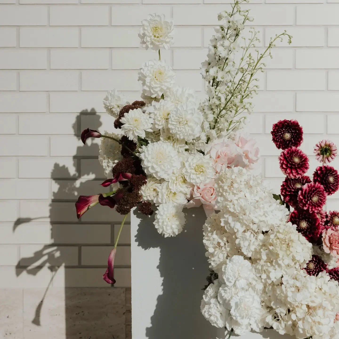 A colour palette I'm loving for these cool winter days!!
Fresh white and ivory with burgundy and chocolate, and a hint of a softer tone like pink, powder blue or lilac 🥹🫶

I absolutely loved creating these pieces for Chloe and Giles at The Calile H
