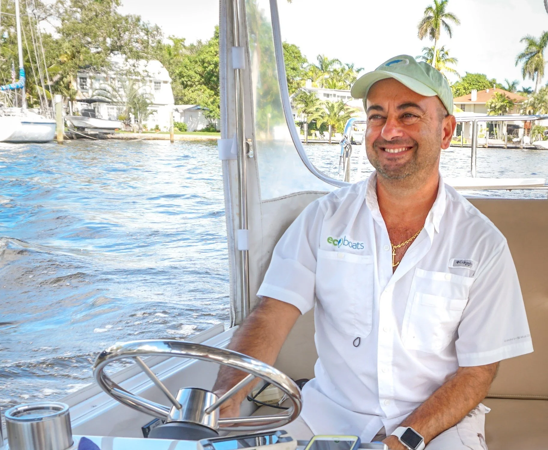 EcoBoats captain smiling aboard an electric boat on a Fort Lauderdale cruise