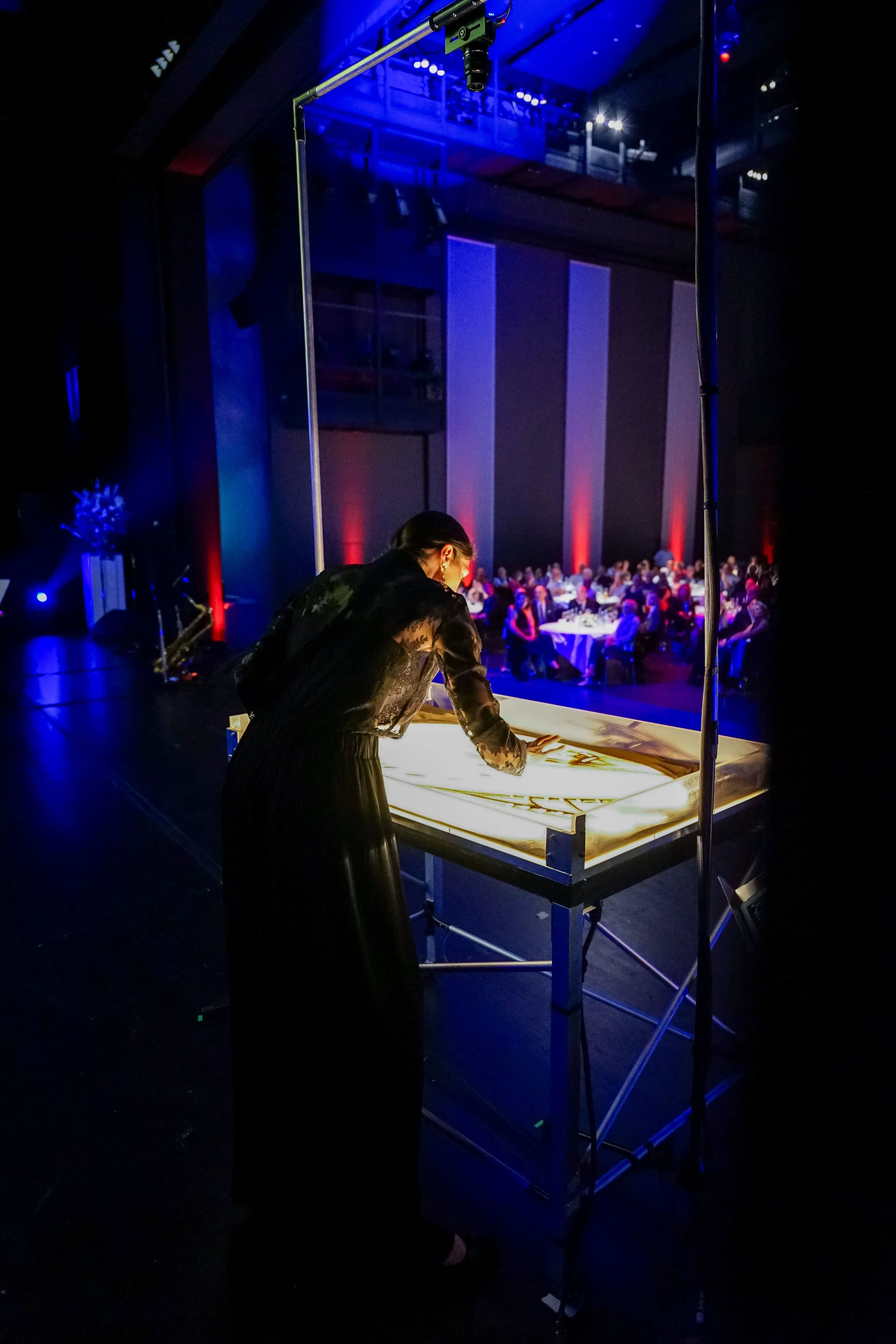 nadia-pretto-Netto-Gruppe-KKL-spettacolo-sand-art-evento-corporate.jpg