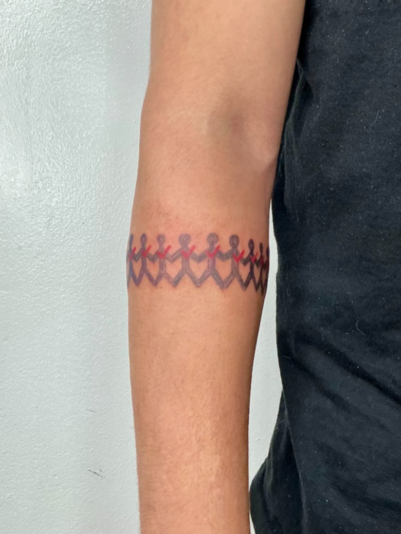 Tattoo of Three Days Grace around the upper arm.