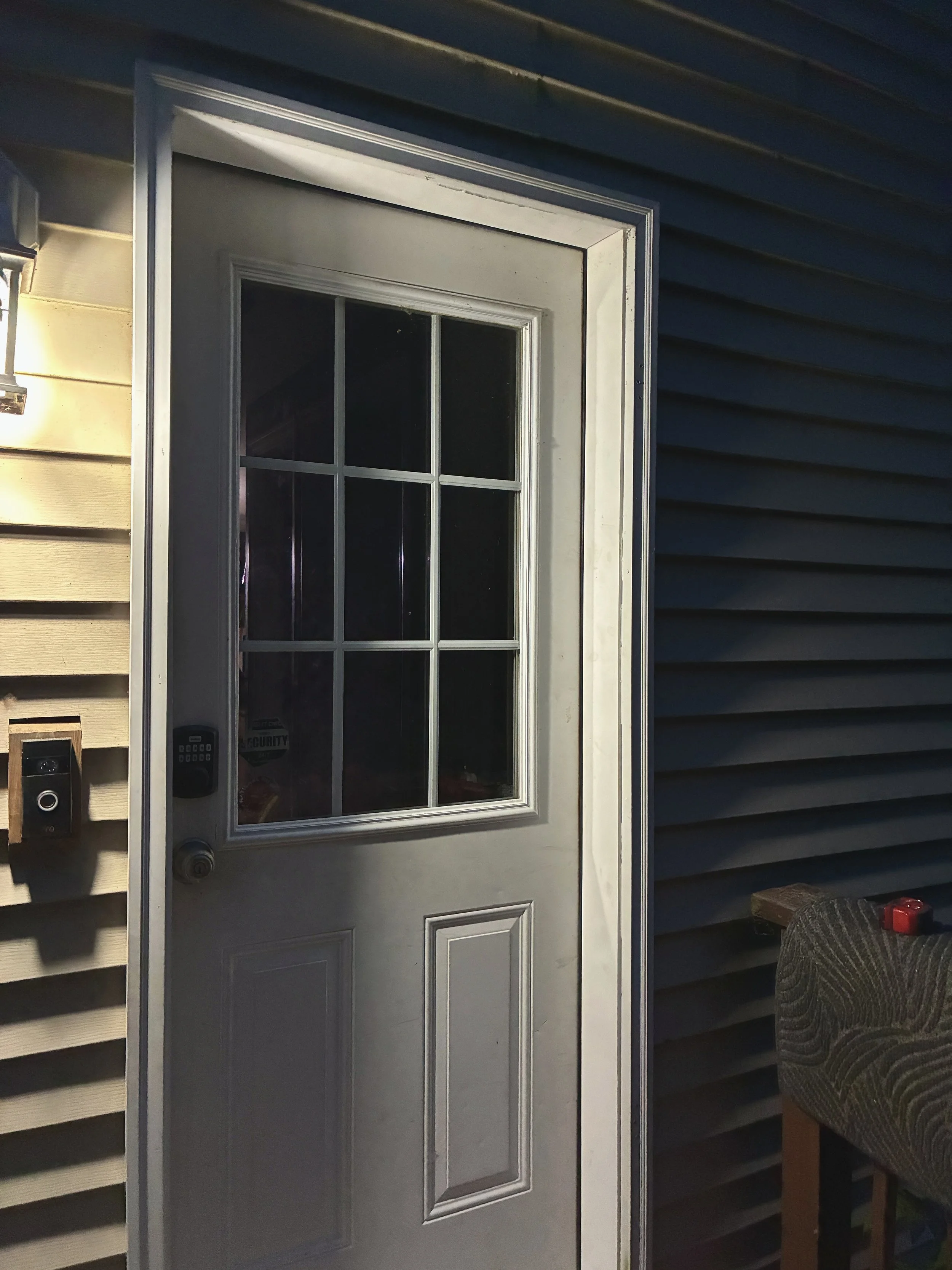 Old door fitted into place. The strike plates for both the latch and deadbolt were chiseled into place.