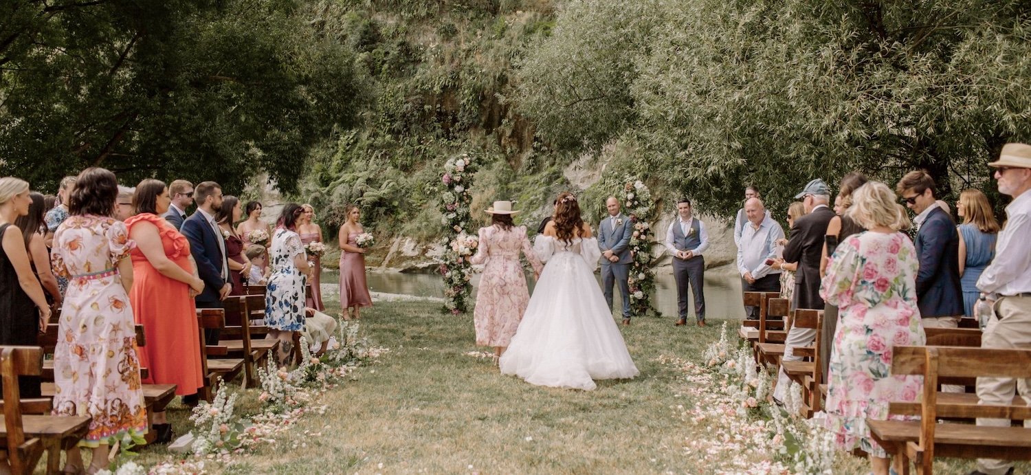 An outdoor wedding ceremony on the banks of the Rangitikei River and under the White Papa Cliffs.